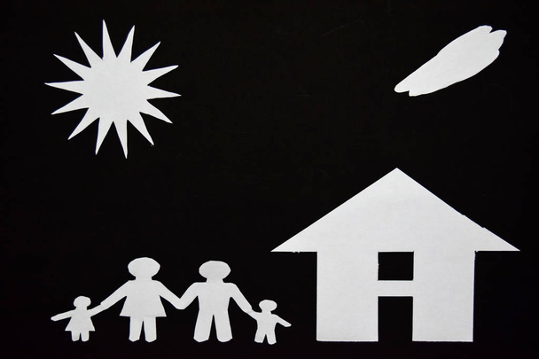 concept image of make your a house. Paper cut of family with house and tree - Foto, Imagen