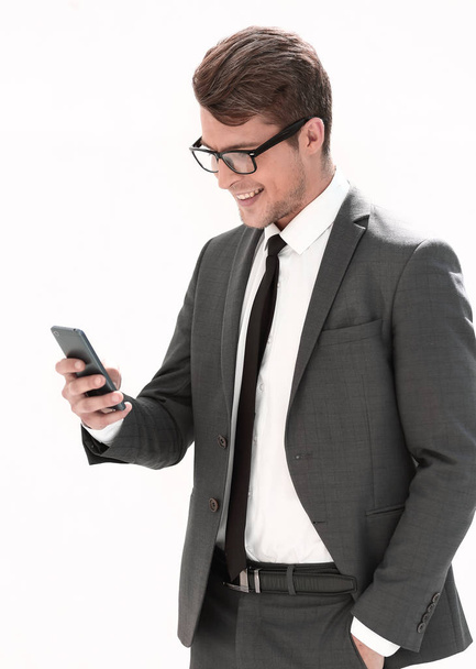smiling businessman looking at the screen of his smartphone - Foto, immagini