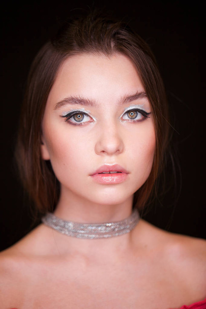 Close up Make up fashion model. Young beautiful brunette girl, on studio black wall background - 写真・画像