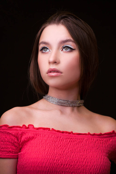 Close up Make up fashion model. Young beautiful brunette girl, on studio black wall background - Fotó, kép