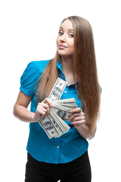 Close-up portrait of playful beautiful woman holding bumch of money,  isolated over white background - Fotó, kép