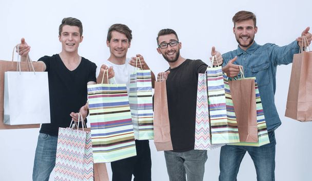paper bags in the hands of a team of friends - Фото, изображение