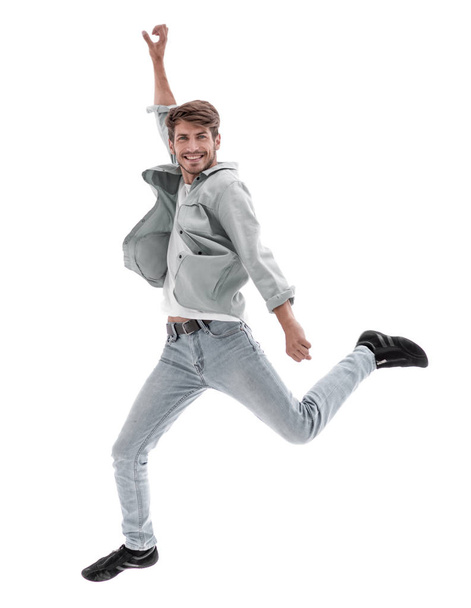 Happy man jumping in air over white background - Fotó, kép