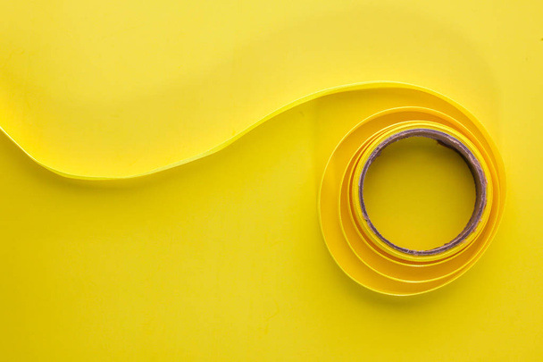 Yellow  ribbon on yellow background - Photo, Image