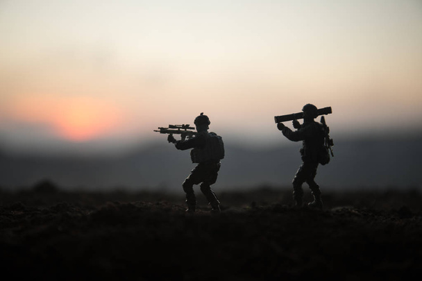Battle scene. Military silhouettes fighting scene on war fog sky background. World War Soldiers Silhouettes Below Cloudy Skyline At sunset. Artwork Decoration. Selective focus - Photo, Image