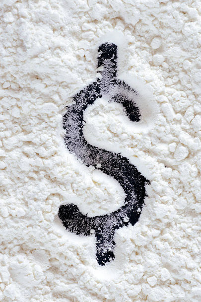 Dollar sign on sprinkled cocaine on black table - Photo, Image