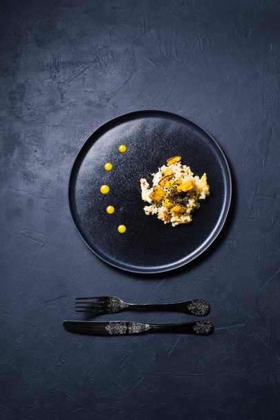 Salad of baked pumpkin, quinoa and chicken. Dark background, top view, space for text - Fotografie, Obrázek