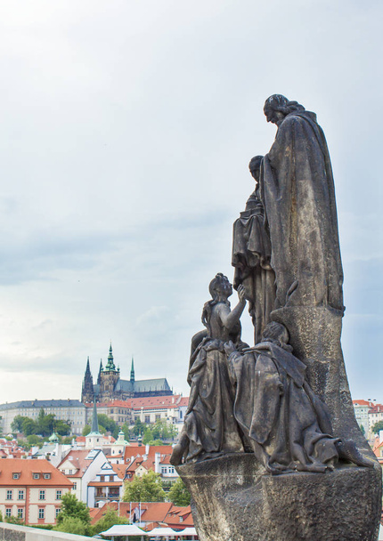 Statues on the Charles Bridge in Prague. Architecture of Prague old town - Photo, Image