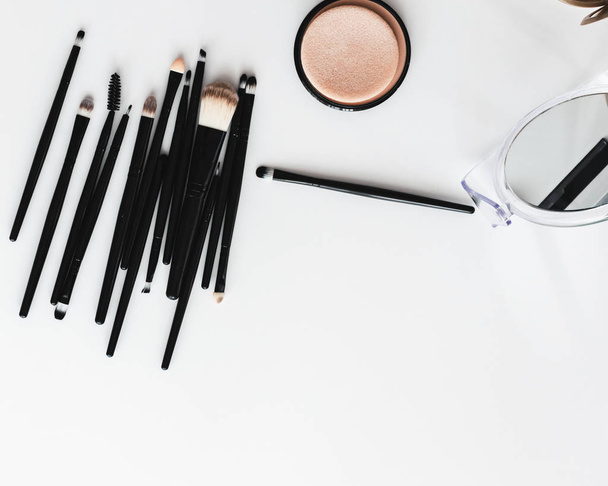 Set of cosmetics, makeup tools and accessories on a white background. View from above. - Photo, image
