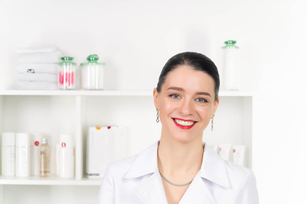 Woman beautician doctor at work in spa center. Portrait of a young female professional cosmetologist. Female employee in cosmetology cabinet or beauty parlor. Healthcare occupation, medical career - Photo, Image