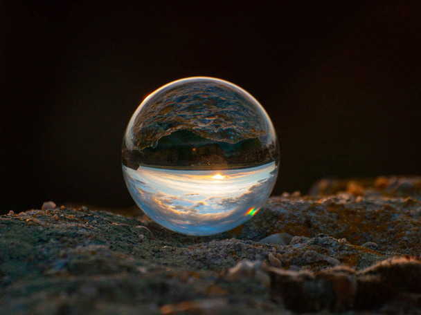 Reflections of the sunset in a cloudy day in a crystal ball  in Cabeza de Diego Gomez , Salamanca ,Spain - Foto, Imagem