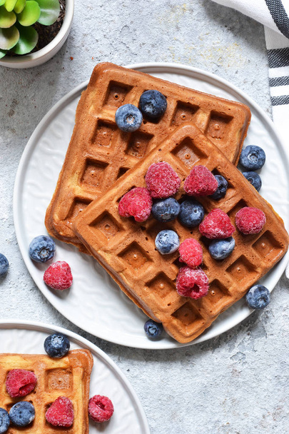 Belgian waffles on a kitchen concrete table. View from above. - Foto, Imagen