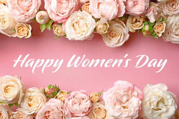 Flat lay composition with beautiful roses and text Happy Women's Day on pink background - Foto, Bild