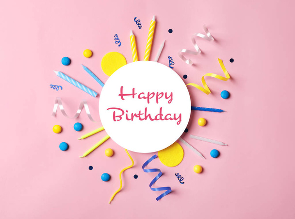 Flat lay composition with party items and text Happy Birthday on pink background - 写真・画像