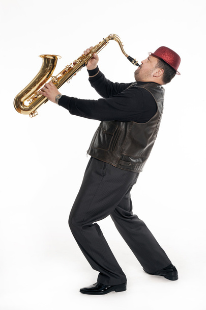 saxofonista com uma cerda
 - Foto, Imagem