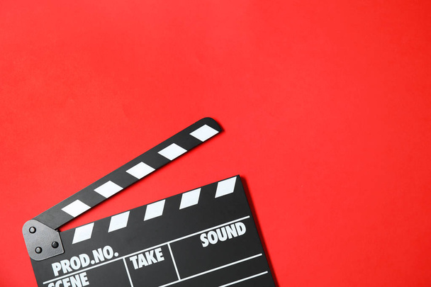 Clapperboard on color background, top view with space for text. Cinema production - Fotoğraf, Görsel