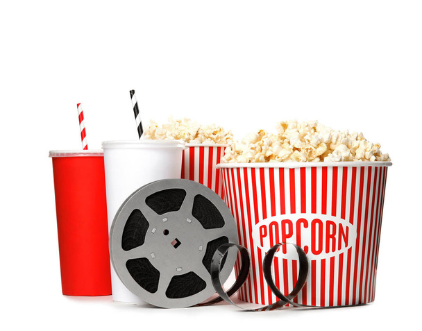 Popcorn, drinks and reel isolated on white. Cinema snack - Photo, image