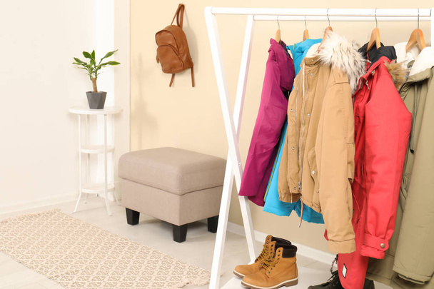 Stylish hallway interior with clothes on hanger stand - Foto, Imagen