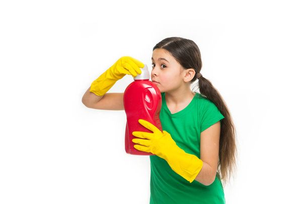 Check smell. Girl in rubber gloves for cleaning hold big plastic bottle chemical soap liquid white background. Use professional product for cleaning. Useful product housekeeping. Cleaning supplies - Φωτογραφία, εικόνα