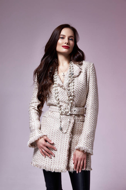 Beautiful woman lady spring autumn collection glamor model business office fashion clothes wear casual style beige color suit blouse jacket skirt pretty face dark hair background studio. - Photo, image