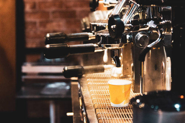 espresso shot from coffee machine in coffee shop,Coffee maker in coffee shop - Foto, imagen
