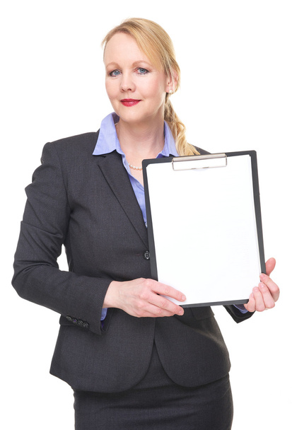 Portrait of a businesswoman holding blank sign clipboard - Foto, afbeelding