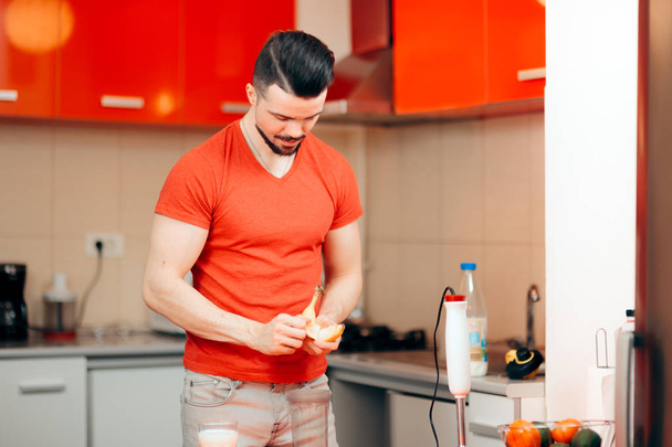 Handsome Man Preparing Protein Shake with Raw Eggs and Banana - Zdjęcie, obraz