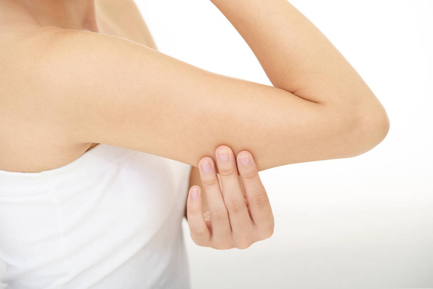 Woman checking her upper arm - Photo, Image