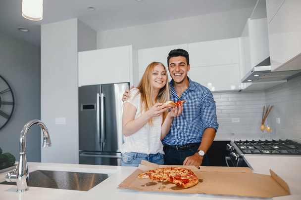 couple eating a pizza - Photo, image