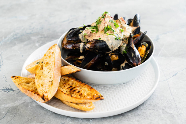 Mussels with herbs in a bowl  - Photo, Image