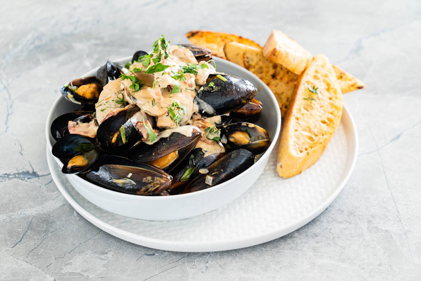 Mussels with herbs in a bowl  - Fotoğraf, Görsel