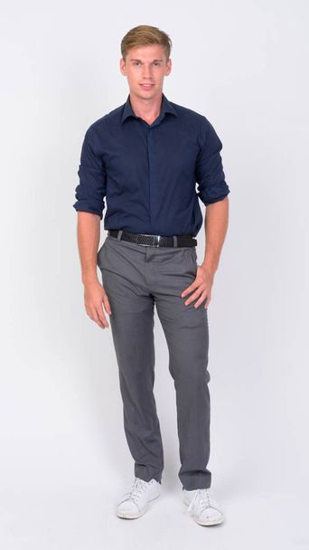 Full body shot of young handsome businessman with blond hair - Zdjęcie, obraz