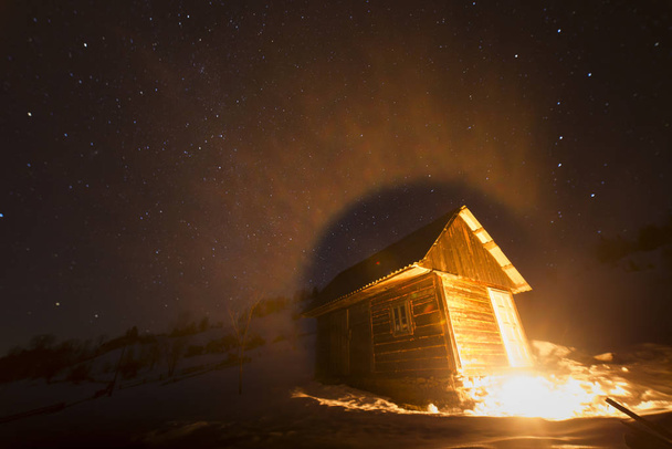 wooden house in winter forest snow mountain, - Foto, Bild