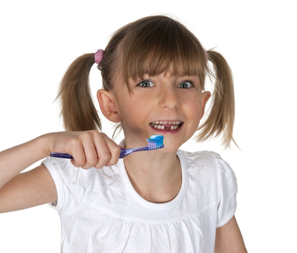 young girl brushing teeth - Fotó, kép