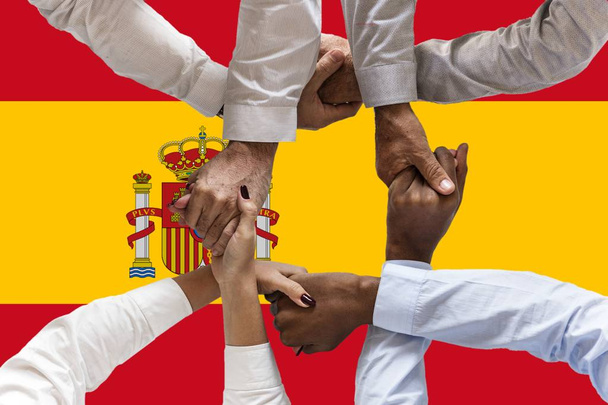 spain flag, intergration of a multicultural group of young people - Photo, Image