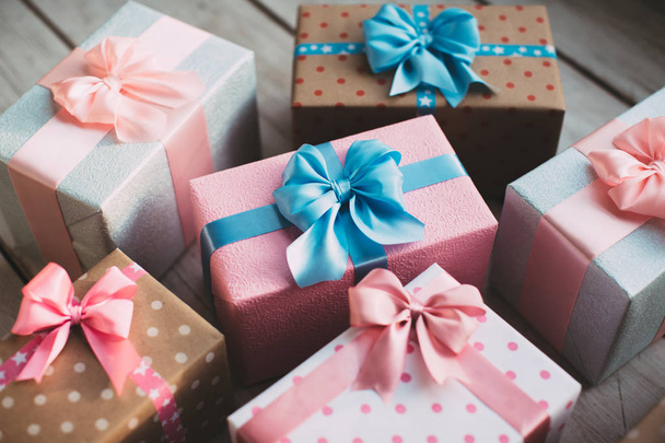 Gift boxes with bows. Holiday background. - Фото, изображение