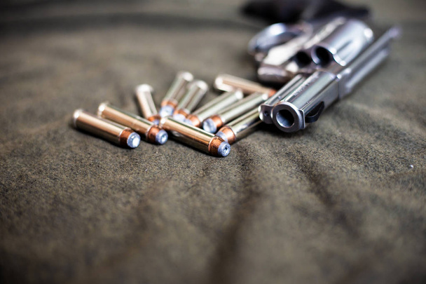 .357 magnum revolver stainless steel hand gun on cloth background - Photo, Image