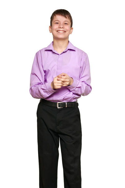 Boy posing on white background, black trousers and purple shirt - Φωτογραφία, εικόνα