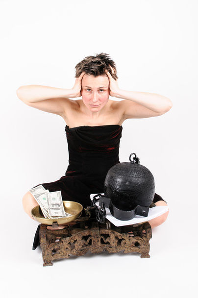 Woman with scales, money and prison ball - Photo, Image