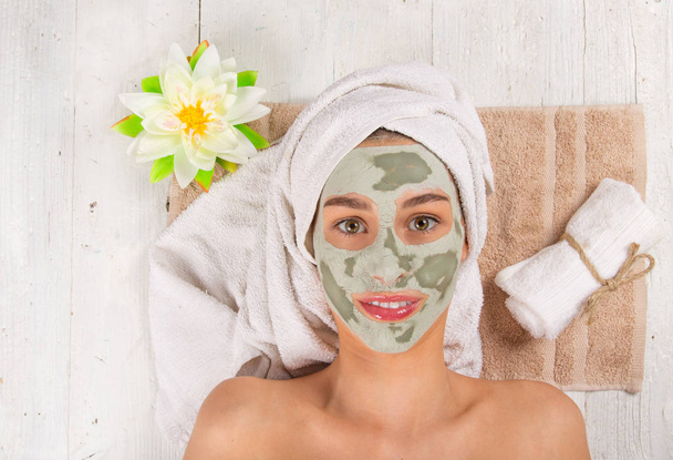 Young healthy woman with face mask. - Фото, изображение