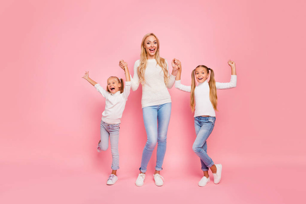 Full length size body portrait of nice cute attractive charming lovely lovable cheerful cheery kind people mom mum holding hands spending free spare time isolated over pink pastel background - Foto, imagen