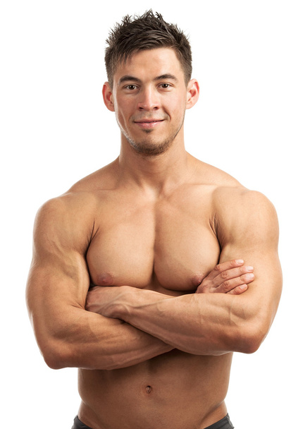Portrait d'un beau jeune homme avec un grand physique posant sur fond blanc
 - Photo, image