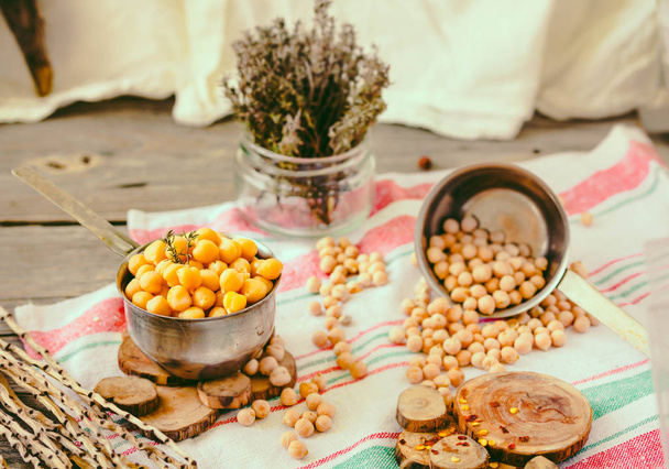 Dried and boiled chickpeas. Vegetarian protein. Dry thyme sprigs in a jar. Healthy lifestyle and balanced food concept. Selective focus. - Фото, зображення