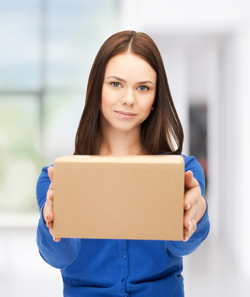 Businesswoman delivering box - Foto, Bild