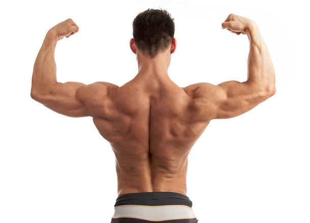 Vista trasera de un hombre joven flexionando los músculos de su brazo y espalda sobre fondo blanco
 - Foto, imagen