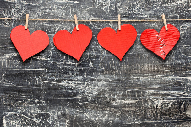 Valentine's Day background. One of four hearts are broken - Foto, Imagen