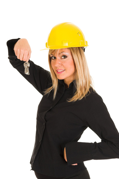 A businesswoman with keys - Фото, изображение
