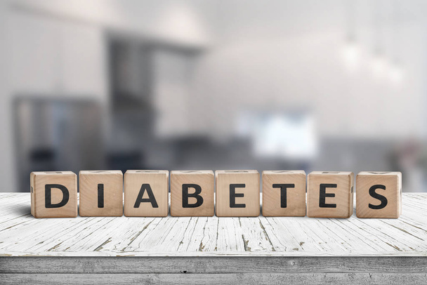 Diabetes disease sign on a table in a bright kitchen in daylight - Photo, Image