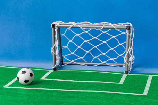 Toy football field and gate - sport background - Фото, изображение