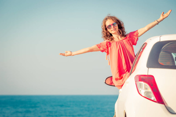 Happy woman travel by car. Person having fun on the beach. Summer vacation concept - Photo, Image